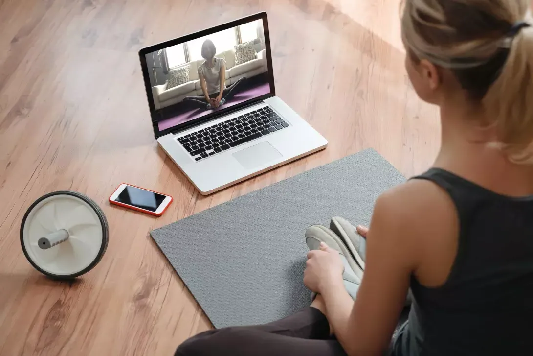 Yoga teacher in a virtual class